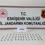 Tarihi eser kaçakçısı çantasındaki sikkelerle yakalandı